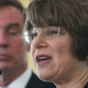 U.S. Sen. Amy Klobuchar (D-MN) (R) speaks as Sen. Mark Warner (D-VA) (L) listens during a news conference at Ronald Reagan Washington National Airport on May 16, 2016 in Arlington, Virginia. Photo: Getty